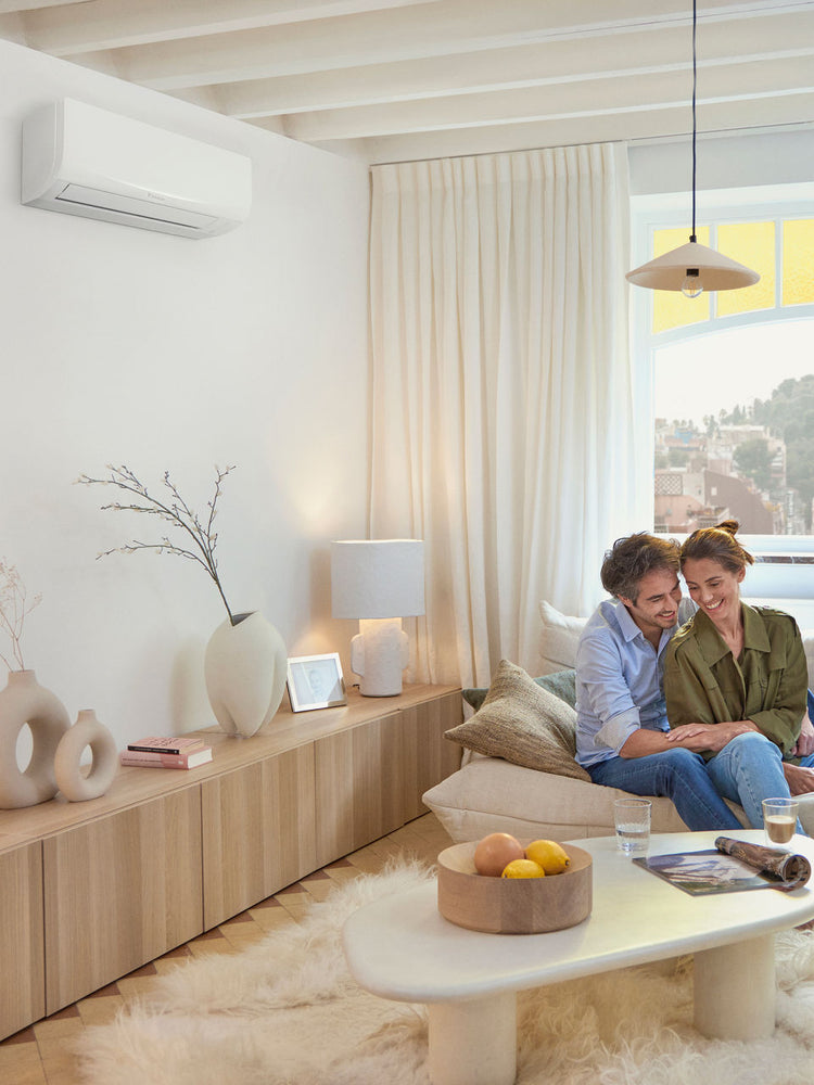 Daikin Sensira wall-mounted air conditioner installed in a bright living room